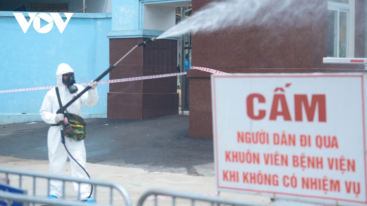 Military forces spray disinfectant at K Hospital's Tan Trieu medical facility